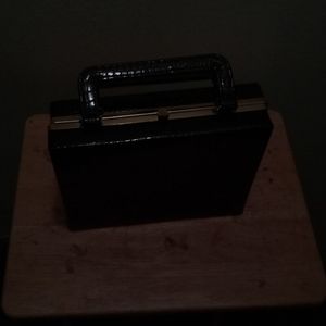 An original square box purse made in Britain